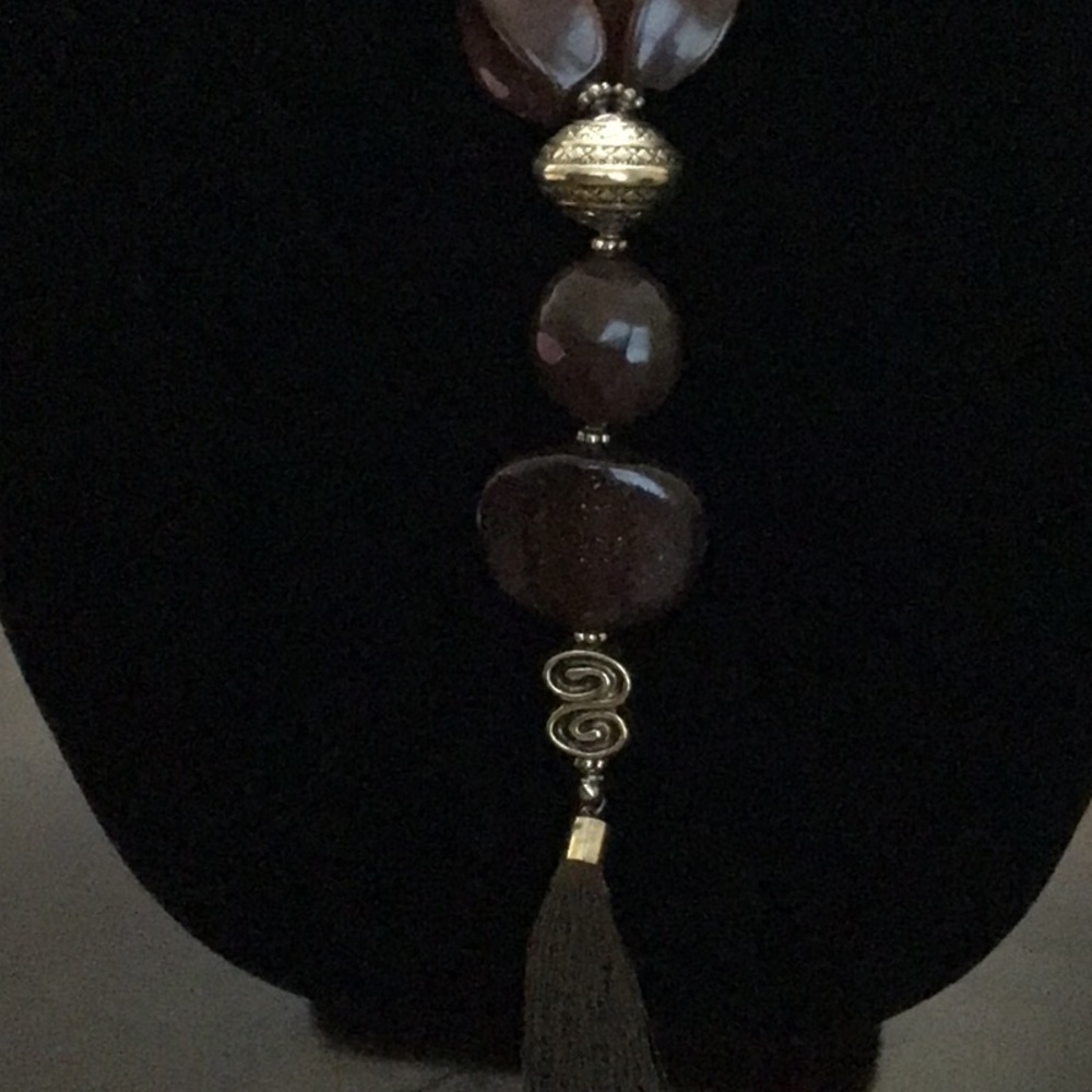 Brown beaded with metal and tassels